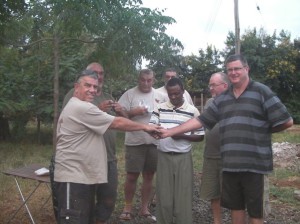 Team members with father Ambrose at the St Joseph catholic mission on the slopes of Kilimanjaro. They handed over 500 deydration spoons for him to distribute to the local clinics plus a monetary donation for allowing us to stay on the missions ground…