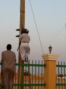 Sudanese electrician at work in full uniform - no electricity – no aircon –no aircon no sleep…..